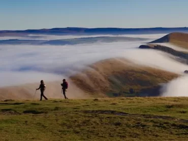 Two walkers enjoying a walking holiday on the Great Ridge in the Peak District