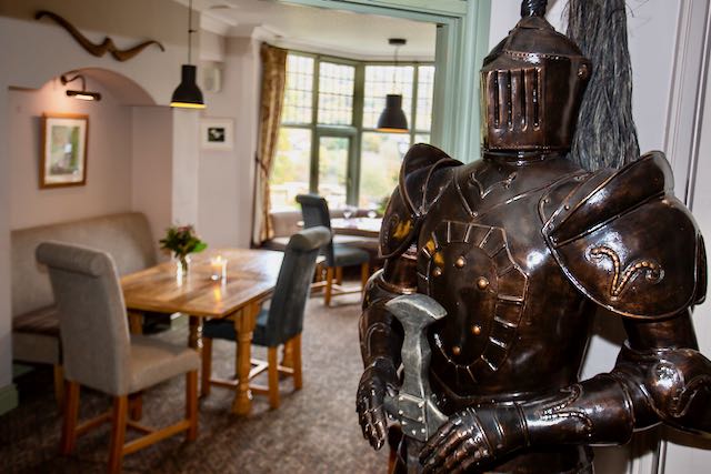 Sir William, the knight in armour guards the entrance to the bar at the Sir William hotel.