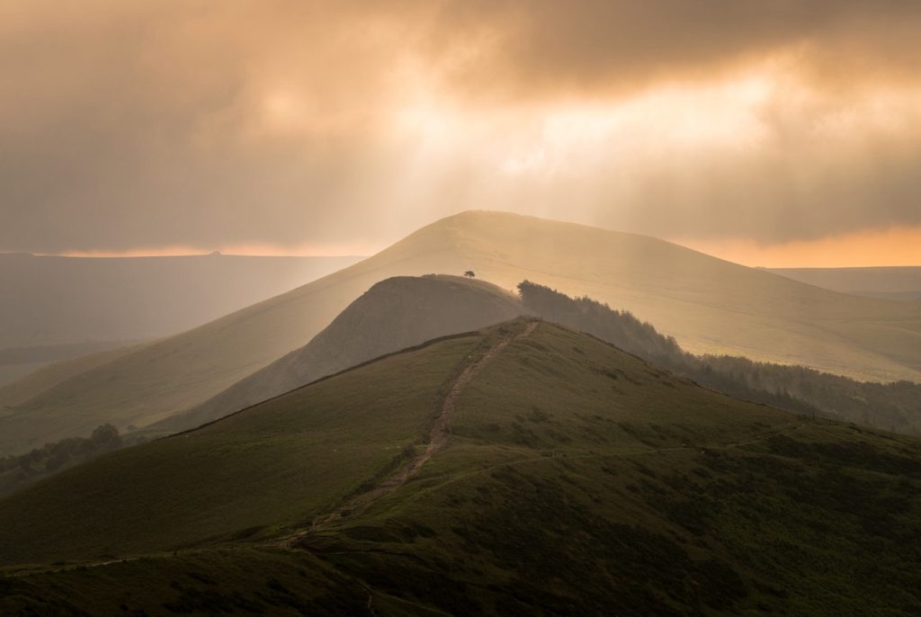 walking the Great ridge above Castleton in the peak District in autumnal light